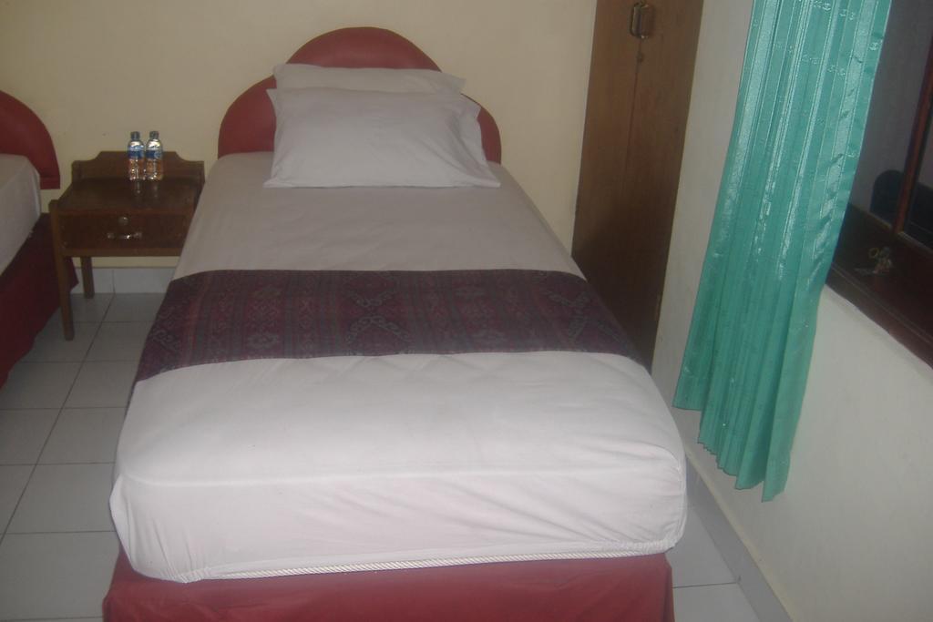 Mustika Inn Кута Номер фото