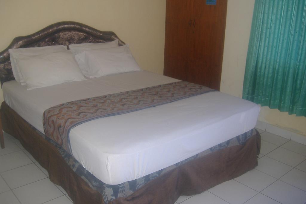 Mustika Inn Кута Номер фото