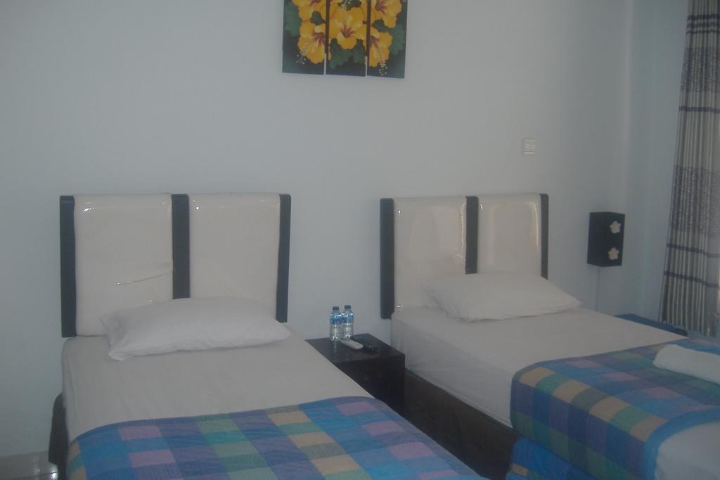 Mustika Inn Кута Номер фото