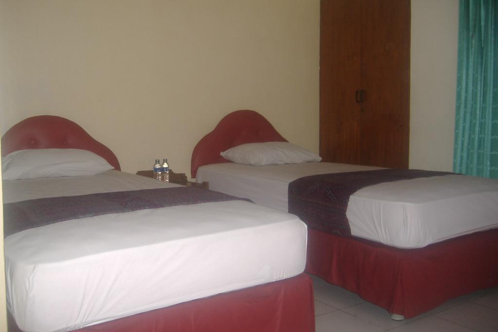 Mustika Inn Кута Номер фото