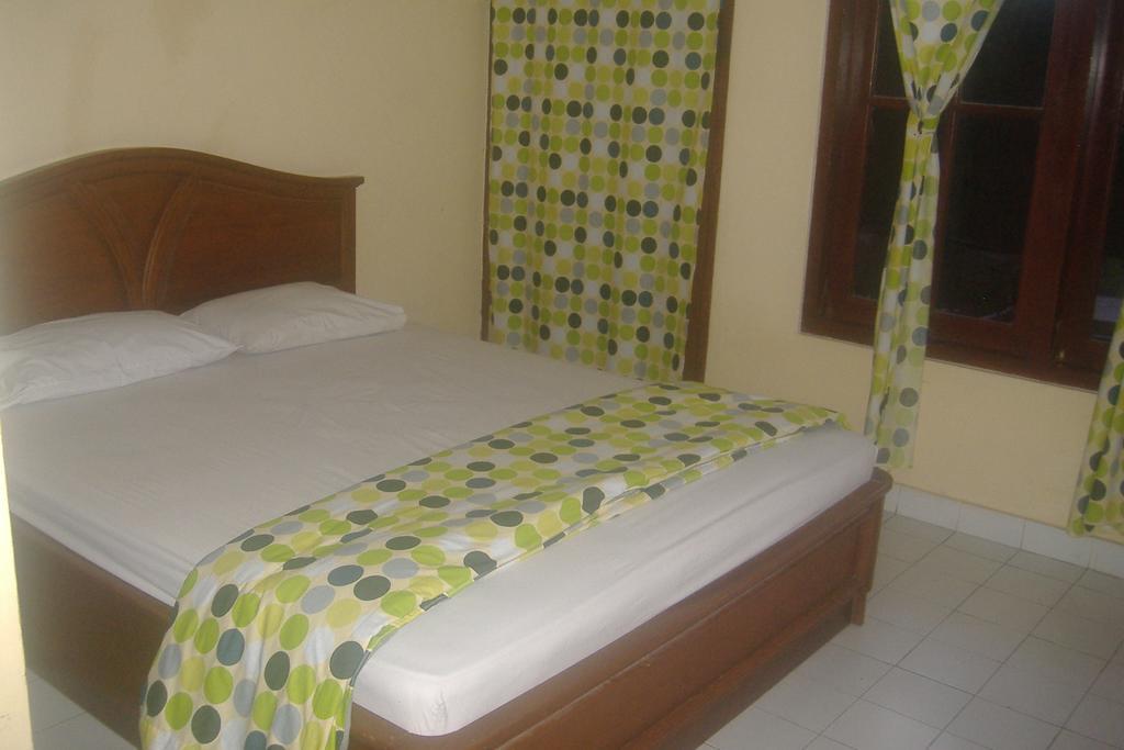 Mustika Inn Кута Номер фото