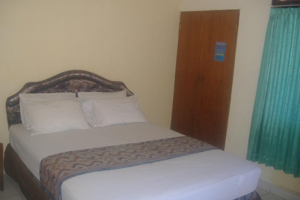 Mustika Inn Кута Номер фото