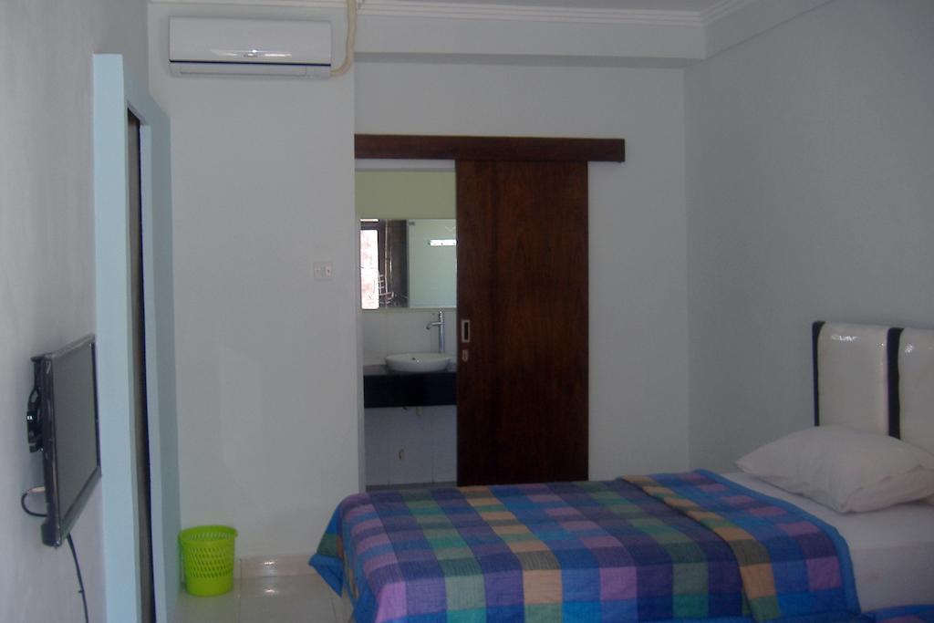 Mustika Inn Кута Номер фото