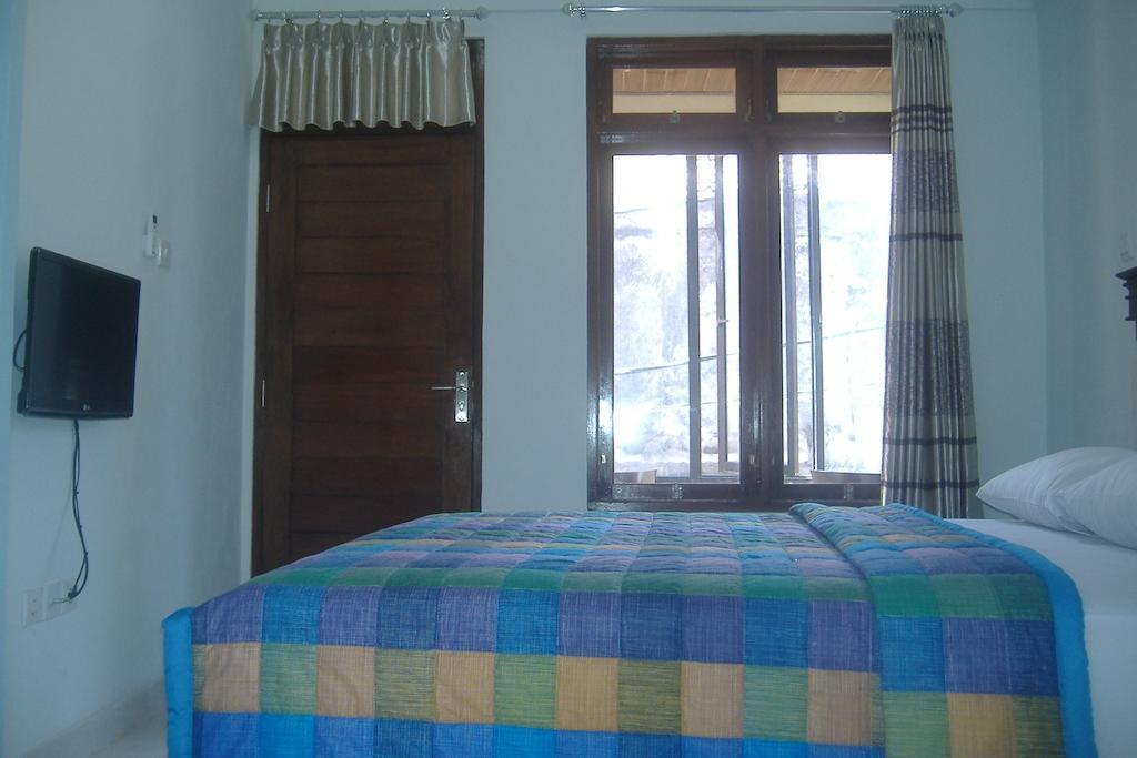Mustika Inn Кута Номер фото