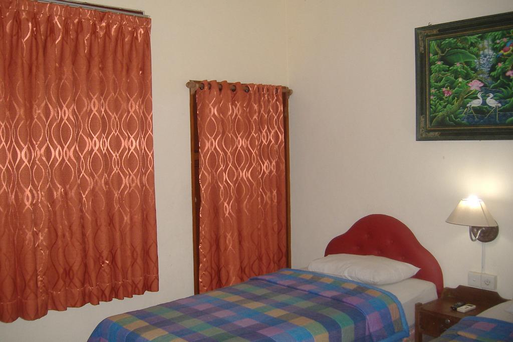 Mustika Inn Кута Номер фото