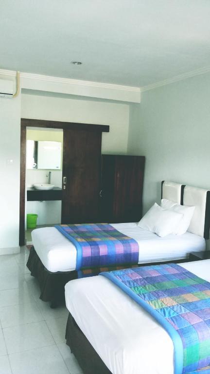 Mustika Inn Кута Номер фото